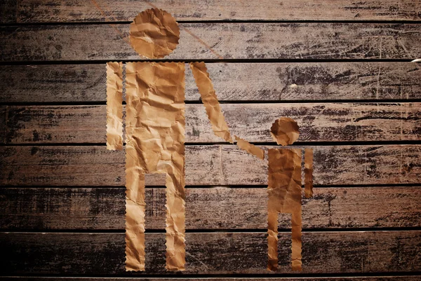 Vintage man and child symbol on the wood texture. — Stock Photo, Image