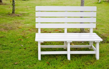 White chair in the park for rest and relax. clipart