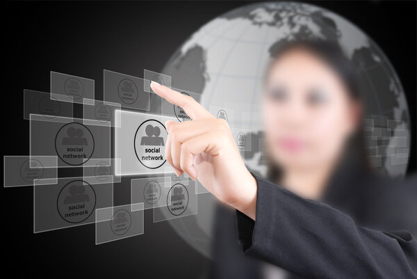 Business lady pushing Social Network button.