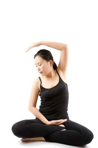 stock image Young Asian woman doing yoga exercise.