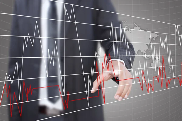 Uomo d'affari spingendo grafico finanza per le azioni commerciali . — Foto Stock
