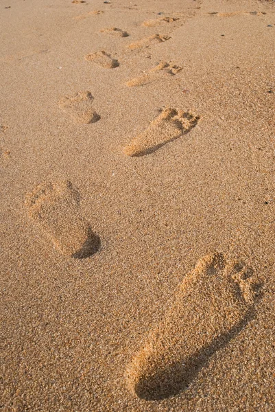 Symbol druku stóp na piasku tekstura tło. — Zdjęcie stockowe