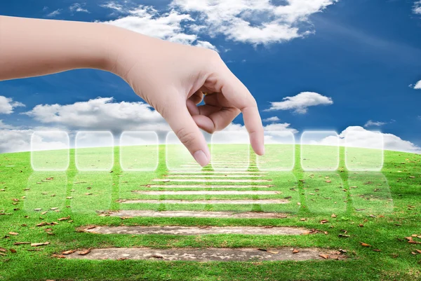 Hand putting button on blue sky field. — Stock Photo, Image