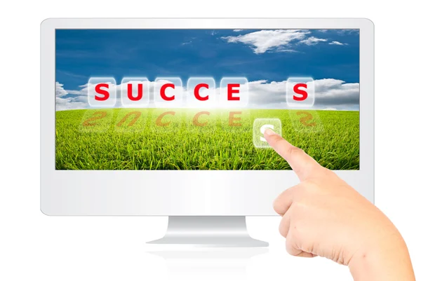 Ręczne przesuwanie słowo sukces na ekranie monitora. — Zdjęcie stockowe