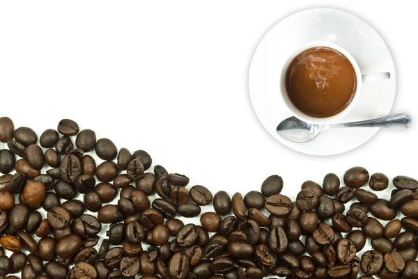 Xícara de café e grãos de café. — Fotografia de Stock