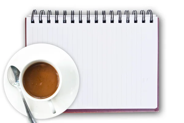 Taza de café en el cuaderno blanco . — Foto de Stock