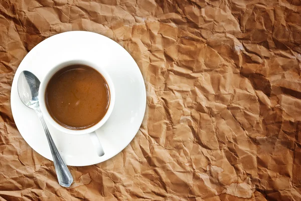 Kaffeetasse auf der Textur des alten Papiers. — Stockfoto