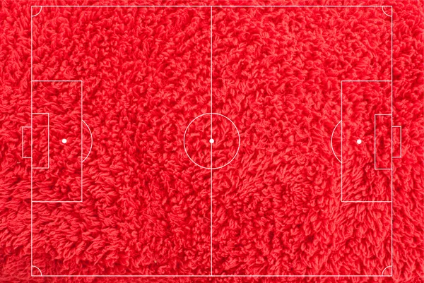 Fotbalové pole textura s červenou látkou. — Stock fotografie