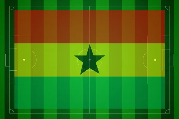 Soccer field with Ghana flag. — Stock Photo, Image