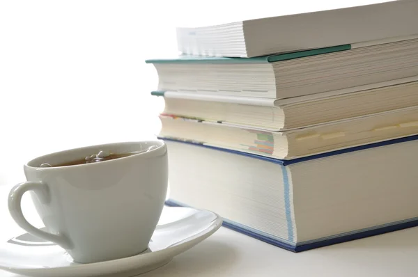 Study scene, coffee and books lit — Stock Photo, Image