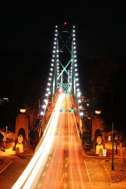 Traffic light on lions gate bridge in Stanley park clipart