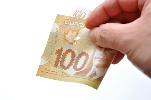 Handing new one hundred bill — Stock Photo, Image