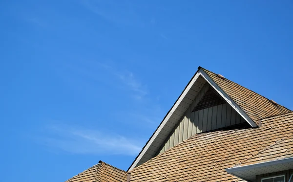 Macro house roof against blue sky — Stock Photo, Image