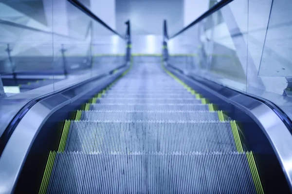 Escalator with blue toned color — Stock Photo, Image