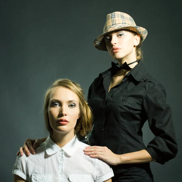 stock image Fashion static portrait of two beautiful women looking in camera