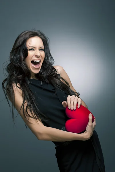 Valentines Day. Beautiful smiling woman with a gift — Stock Photo, Image