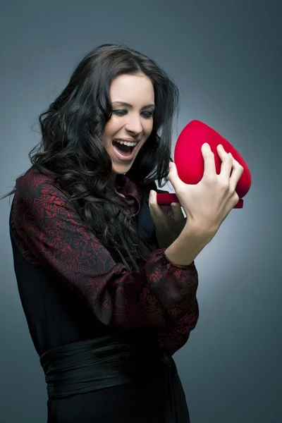 Valentines Day. Beautiful smiling woman with a gift — Stock Photo, Image