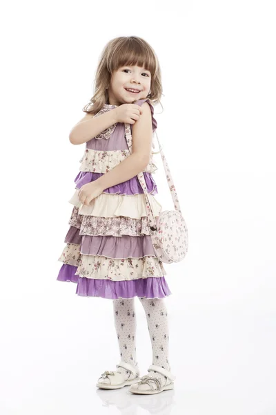 Porträtt av en glad liten flicka med en påse — Stockfoto