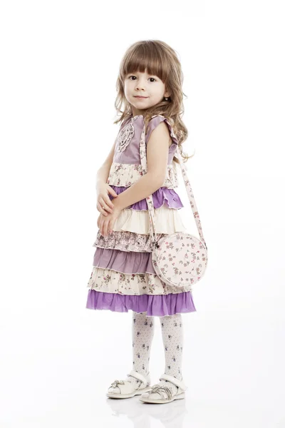 Ritratto di una bambina allegra con una borsa — Foto Stock
