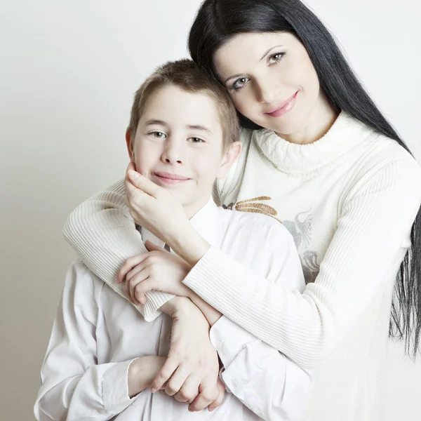Portrait of beautiful smiling family: mother and son — Stock Photo, Image