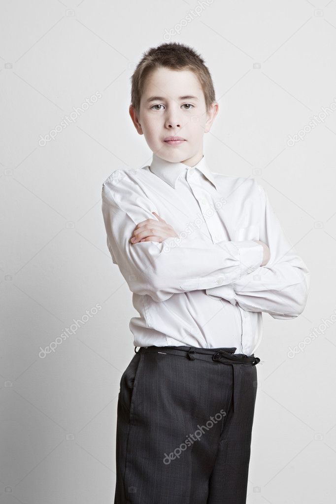 Portrait of a beautiful young boy in a suit