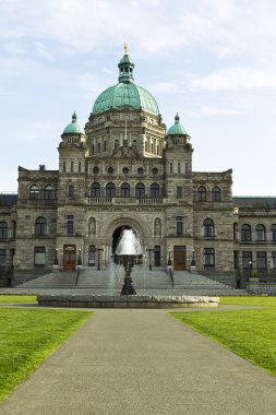 Front view of Victoria Canada capital building with water founta clipart