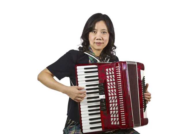 Азиатки играют в аккордеон — стоковое фото