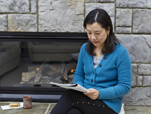 Reading near the Fireplace — Stock Photo, Image