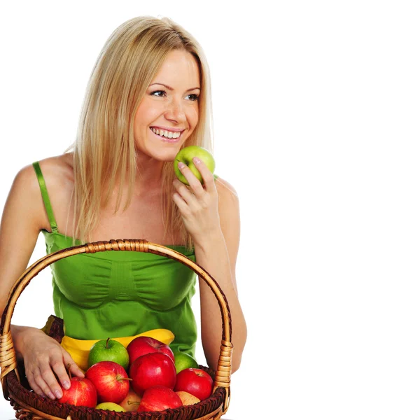 Woman holds a basket of fruit — Stock Photo, Image