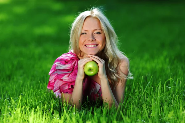 Blonde on green grass — Stock Photo, Image