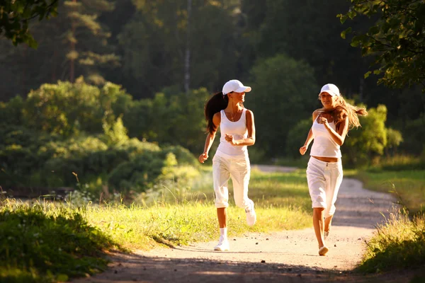 As mulheres correm — Fotografia de Stock
