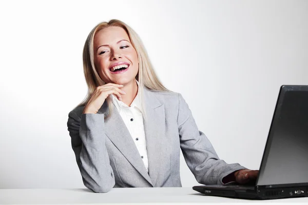 Business woman working on laptop Stock Image