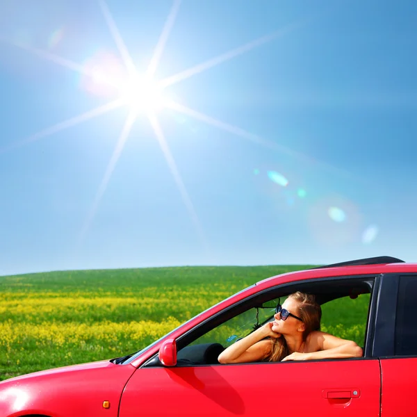 Woman in red car — Stock Photo, Image