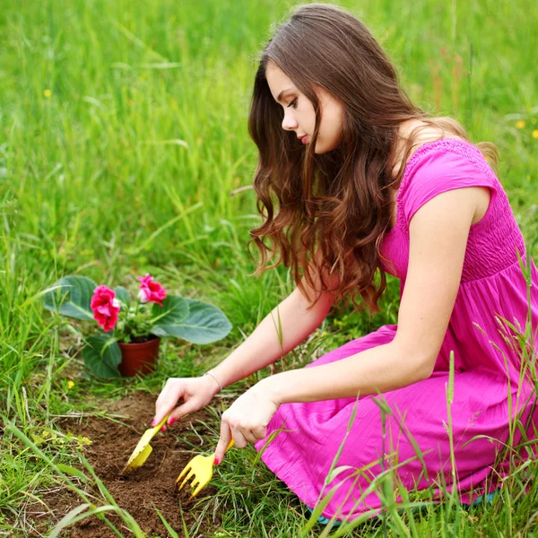 stock image Girl grow flower