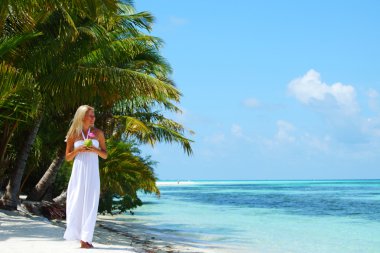 Woman with a coconut cocktail clipart