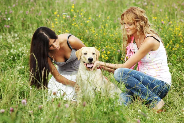 Girlfriends and dog Royalty Free Stock Images