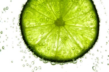 Lime slice in water clipart