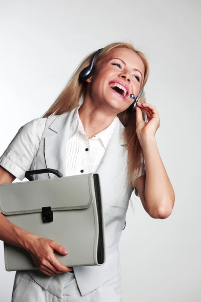 Mujer de negocios con auriculares — Foto de Stock