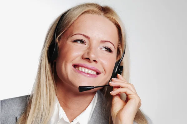 Business woman in a headset — Stock Photo, Image