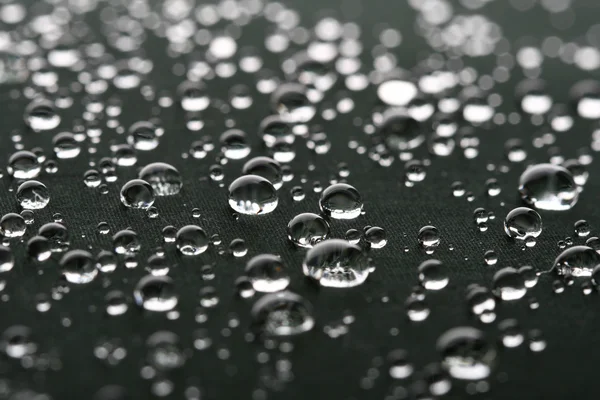 Gotas de agua en superficie gris —  Fotos de Stock