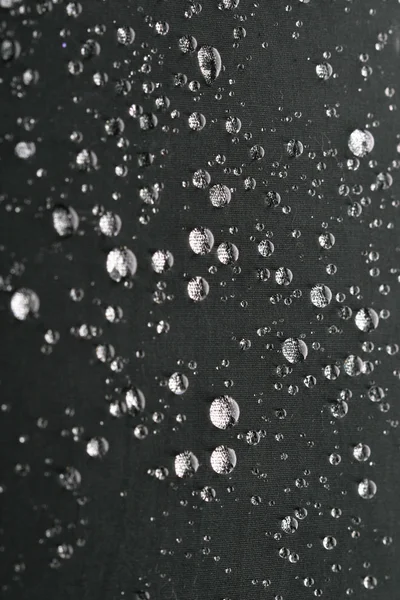 Gocce d'acqua sulla superficie grigia — Foto Stock