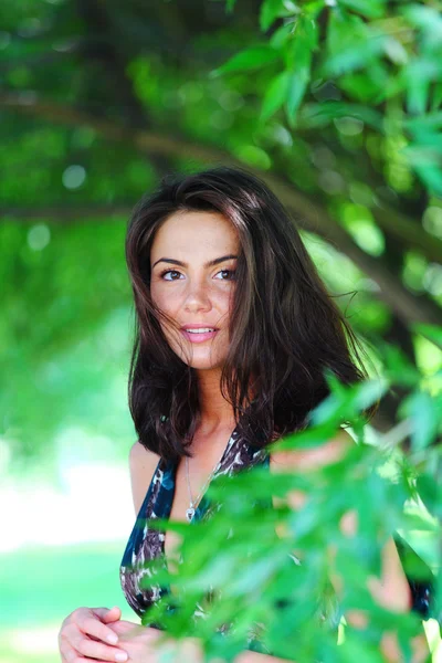 stock image Girl on a background of green trees