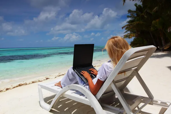 stock image Tropical business woman with laptop