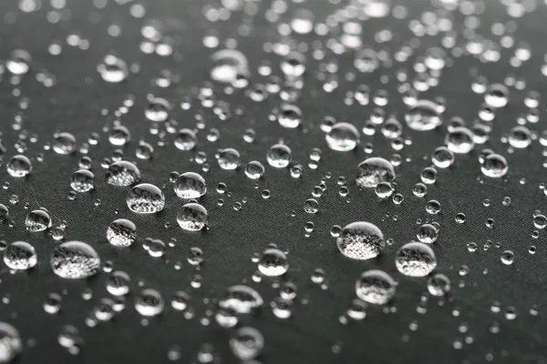 Waterdrops on gray surface — Stock Photo, Image