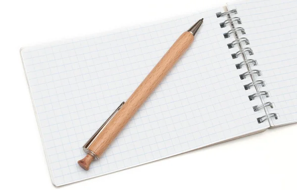 Wooden ball pen and a notebook — Stock Photo, Image