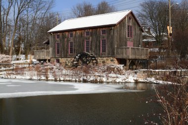 General view Old water mill in winter. clipart