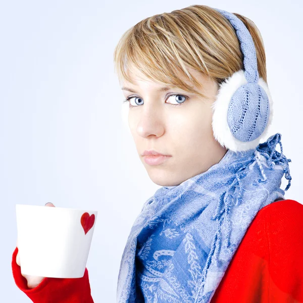 stock image Blond girl holds cup of tea. Image has clipping path.