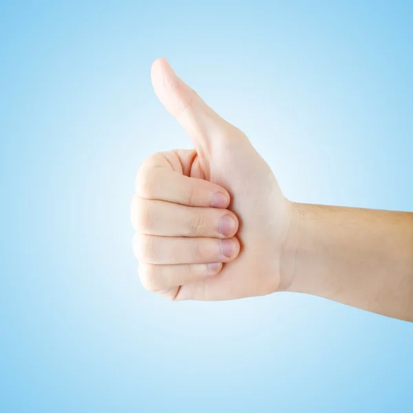 Thumb up gesturing isolated with clipping path Stock Photo