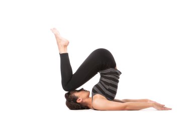 Woman practicing yoga clipart