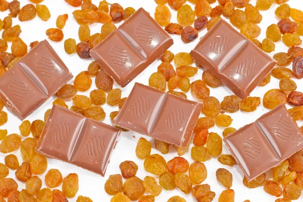 Chocolate bars on raisins — Stock Photo, Image